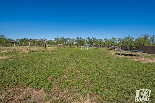 view of yard featuring a trampoline