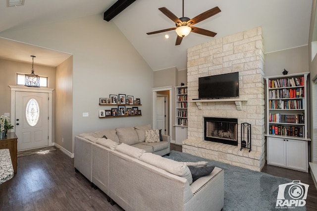 living room with a ceiling fan, dark wood-type flooring, a stone fireplace, high vaulted ceiling, and beam ceiling