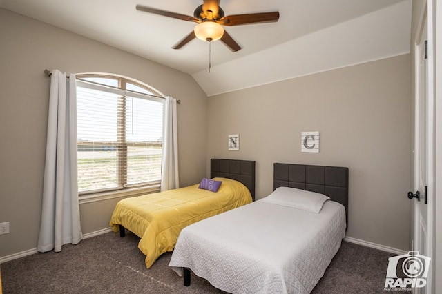 bedroom featuring lofted ceiling, carpet flooring, and baseboards