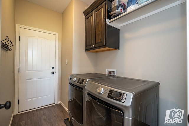 laundry room featuring dark wood-type flooring, cabinet space, independent washer and dryer, and baseboards