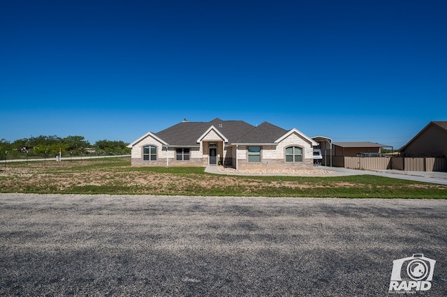 view of front of property with a carport