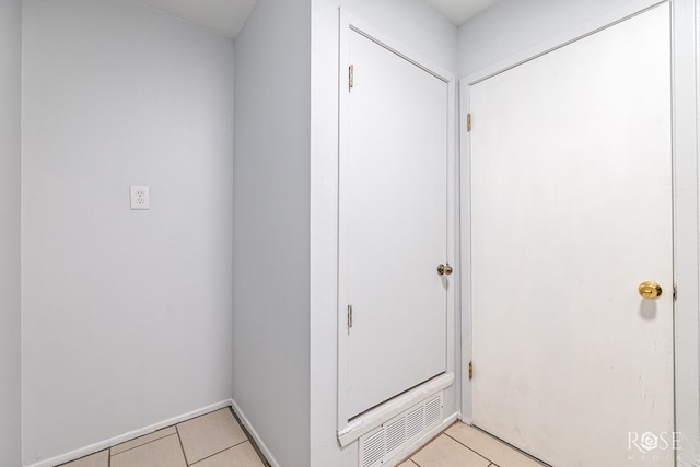 interior space with light tile patterned floors