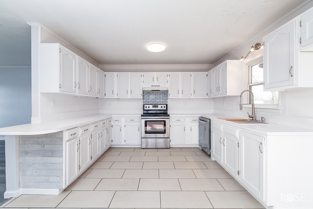 kitchen featuring stainless steel appliances, light tile patterned flooring, sink, and white cabinets