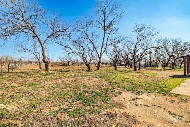 view of yard with a rural view