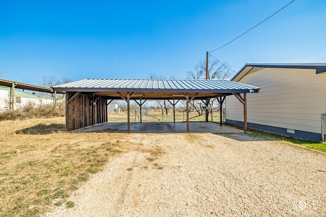 view of parking / parking lot featuring a carport