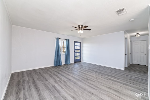 unfurnished room featuring a textured ceiling, wood-type flooring, and ceiling fan