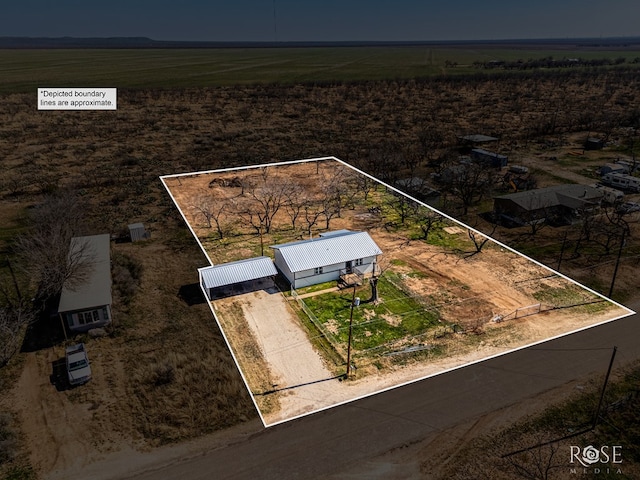 birds eye view of property featuring a rural view