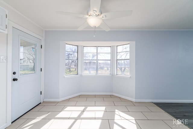 interior space featuring ornamental molding and ceiling fan