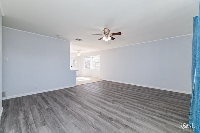 unfurnished living room with dark wood-type flooring and ceiling fan