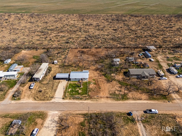 birds eye view of property featuring a rural view