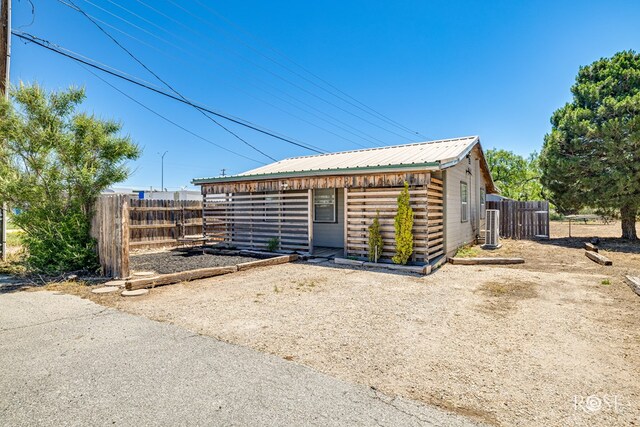 8126 N Fm 2288, San Angelo, TX 76901 - view of front facade featuring metal roof and central AC unit