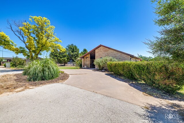 8126 N Fm 2288, San Angelo, TX 76901 - view of side of home with brick siding