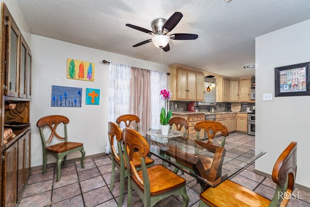 8126 N Fm 2288, San Angelo, TX 76901 - dining area featuring ceiling fan, a textured ceiling, and baseboards