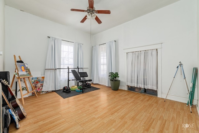 exercise area featuring hardwood / wood-style floors and ceiling fan