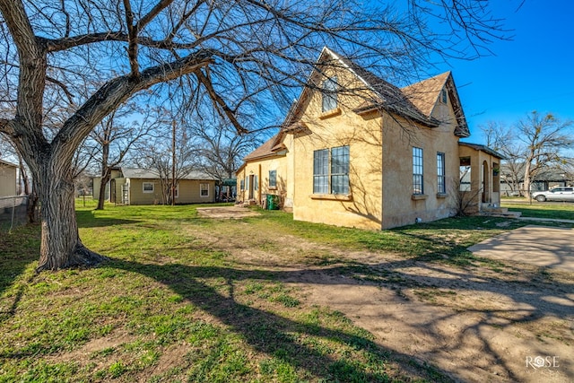 view of property exterior featuring a yard