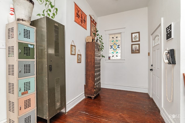 hallway featuring dark wood-type flooring