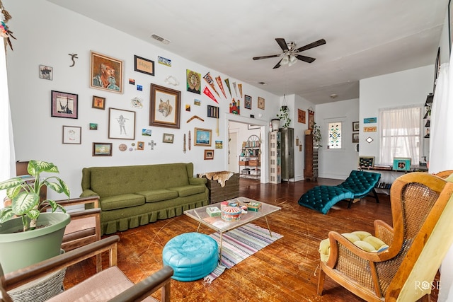 living room featuring hardwood / wood-style floors and ceiling fan