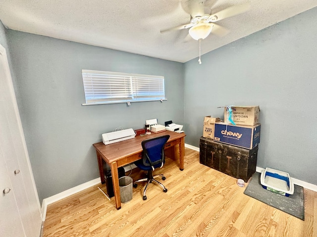 office with ceiling fan, wood-type flooring, and a textured ceiling