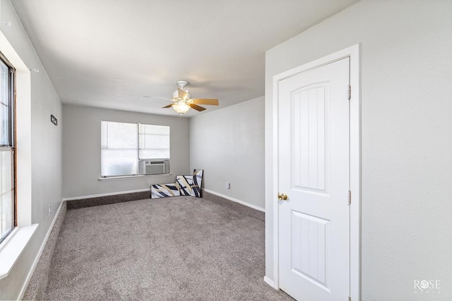 empty room with cooling unit, ceiling fan, and carpet flooring