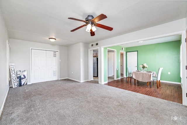 interior space with stainless steel fridge, a closet, and ceiling fan