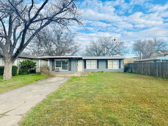 ranch-style house with cooling unit and a front yard