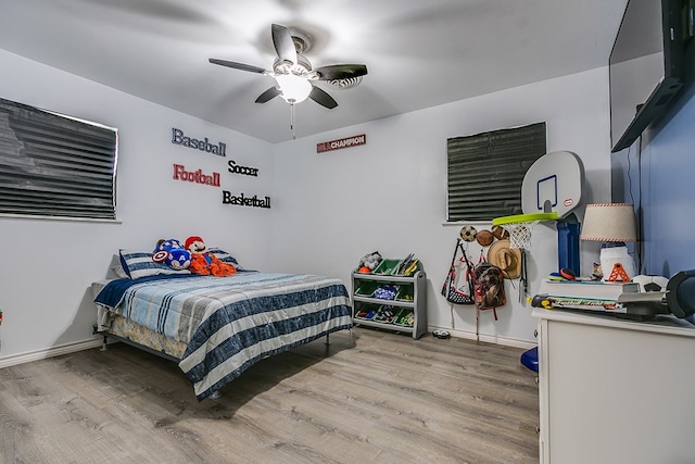 bedroom featuring wood-type flooring and ceiling fan