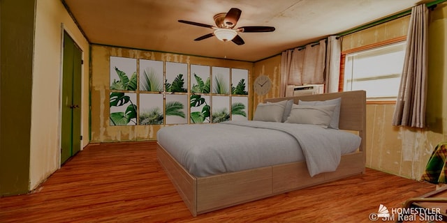 bedroom featuring a ceiling fan and wood finished floors