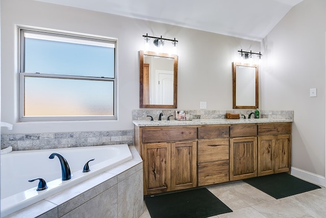 bathroom featuring a sink, tile patterned flooring, double vanity, vaulted ceiling, and a garden tub