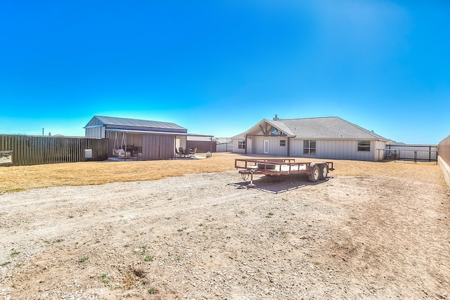 view of yard featuring fence and an outdoor structure