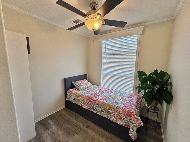 7754 S Copper Mountain Cir, San Angelo, TX 76901 - bedroom featuring wood finished floors, ornamental molding, and ceiling fan