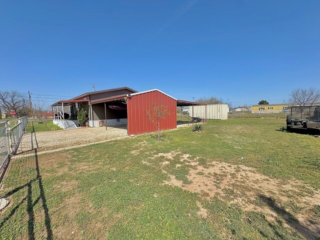7754 S Copper Mountain Cir, San Angelo, TX 76901 - view of yard featuring a pole building and an outbuilding