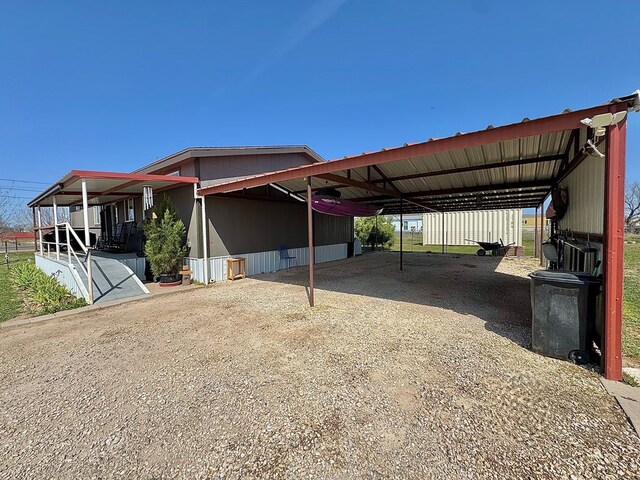 7754 S Copper Mountain Cir, San Angelo, TX 76901 - view of car parking with dirt driveway and a carport