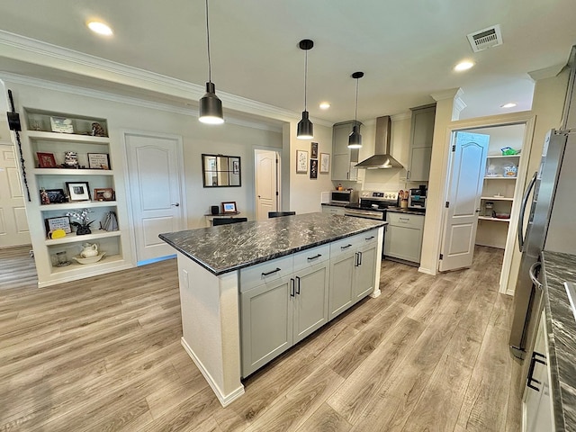 7754 S Copper Mountain Cir, San Angelo, TX 76901 - kitchen with wall chimney exhaust hood, ornamental molding, appliances with stainless steel finishes, light wood-type flooring, and a center island