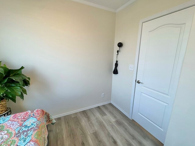 7754 S Copper Mountain Cir, San Angelo, TX 76901 - bedroom featuring crown molding and light wood-style floors