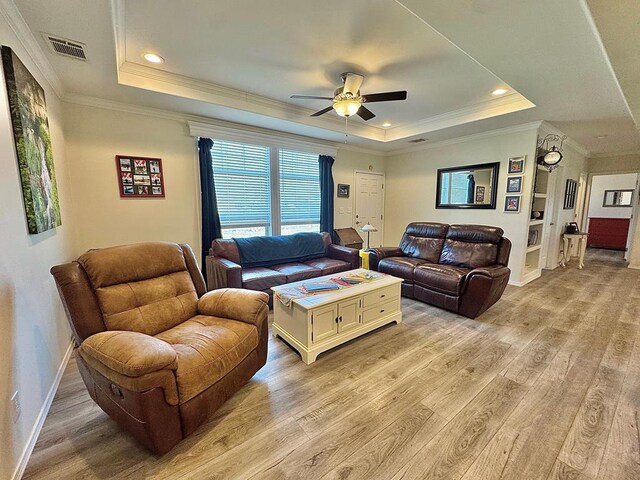 7754 S Copper Mountain Cir, San Angelo, TX 76901 - living room featuring a tray ceiling, light wood finished floors, ceiling fan, ornamental molding, and recessed lighting