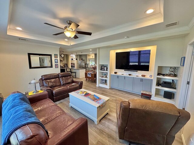 7754 S Copper Mountain Cir, San Angelo, TX 76901 - living area featuring a raised ceiling, light wood finished floors, crown molding, ceiling fan, and recessed lighting