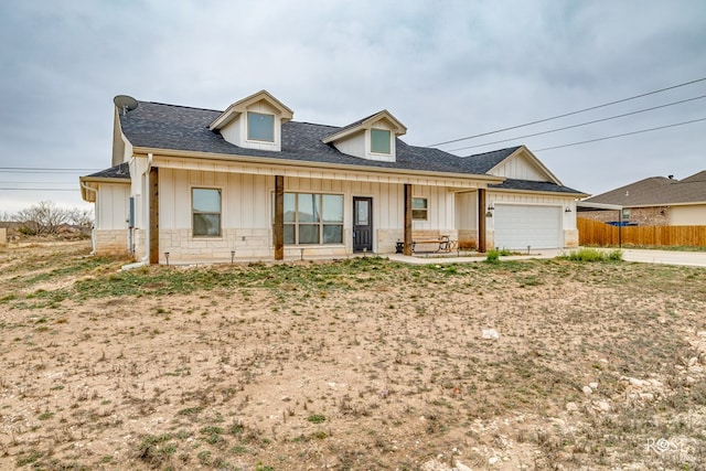 4400 Bobcat Trl, San Angelo, TX 76901 - modern inspired farmhouse with an attached garage, a shingled roof, board and batten siding, and stone siding