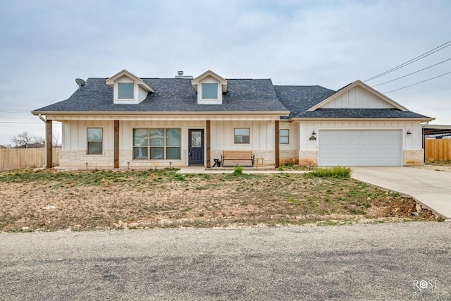 4400 Bobcat Trl, San Angelo, TX 76901 - modern inspired farmhouse with concrete driveway, an attached garage, roof with shingles, and board and batten siding