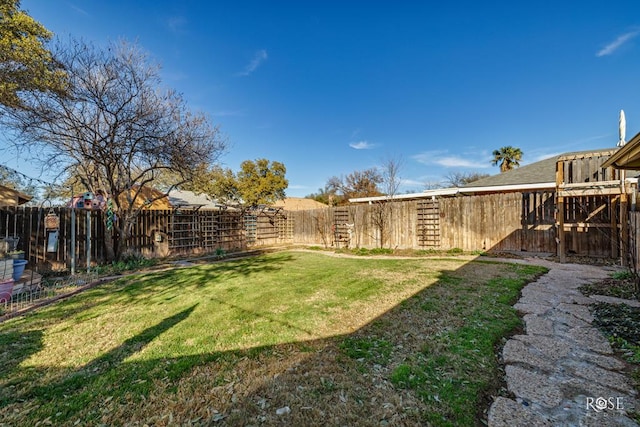 view of yard with a fenced backyard