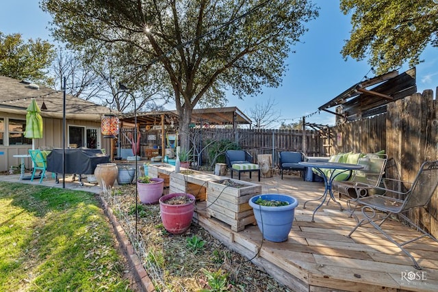 view of yard with a deck and a fenced backyard