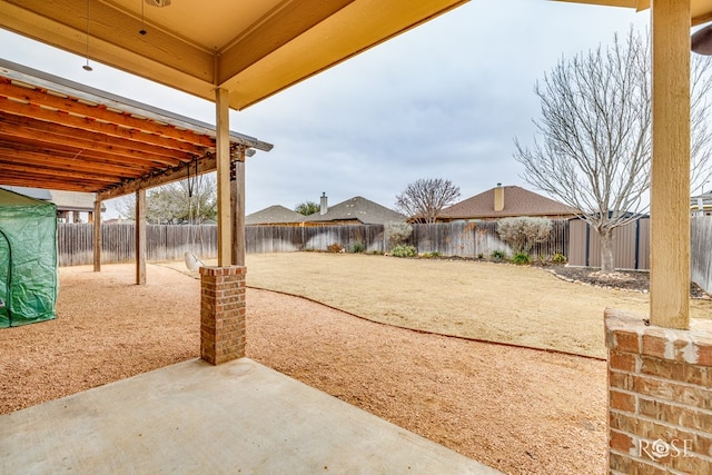 view of yard with a fenced backyard and a patio