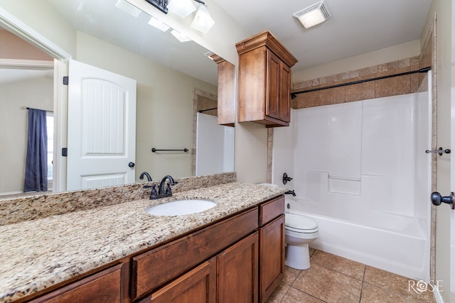 full bathroom with tile patterned flooring, toilet, vanity, visible vents, and  shower combination