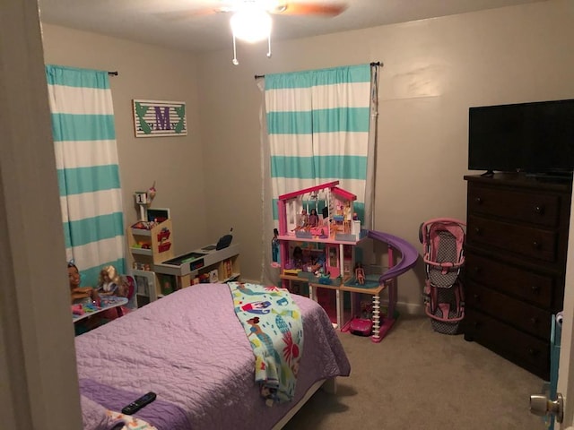 bedroom featuring light colored carpet and ceiling fan