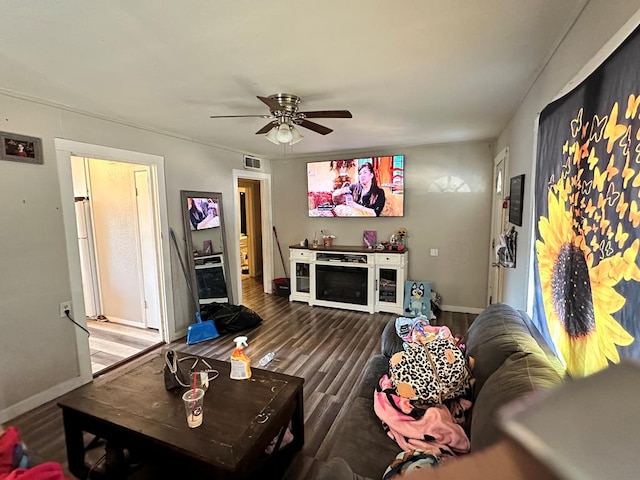 living room featuring wood-type flooring and ceiling fan