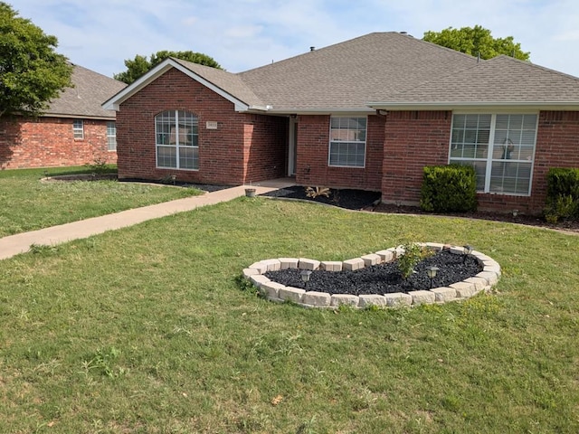 3622 Dominion Rdg, San Angelo, TX 76904 - ranch-style house with a front yard, brick siding, and roof with shingles