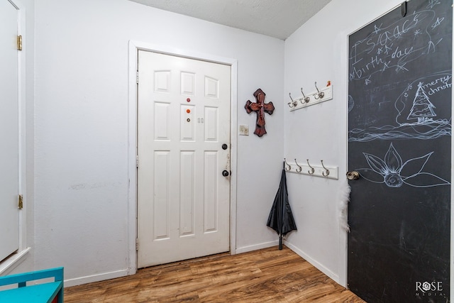 doorway to outside featuring hardwood / wood-style flooring