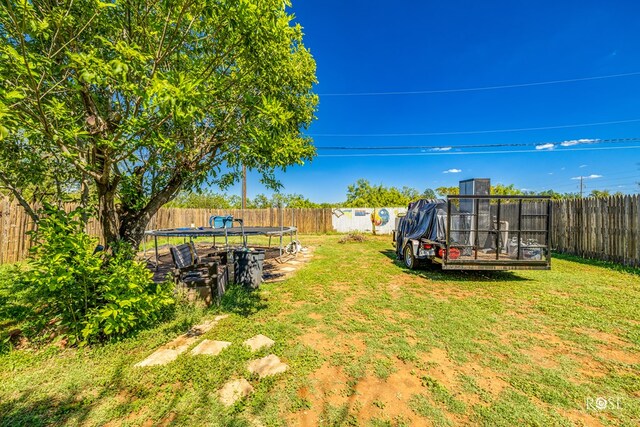 view of yard featuring a trampoline