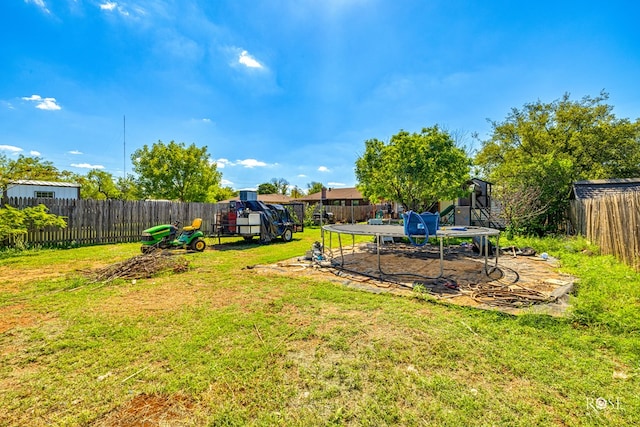 view of yard featuring a trampoline