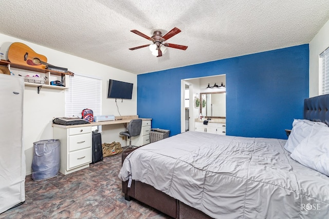 bedroom with a textured ceiling and ceiling fan