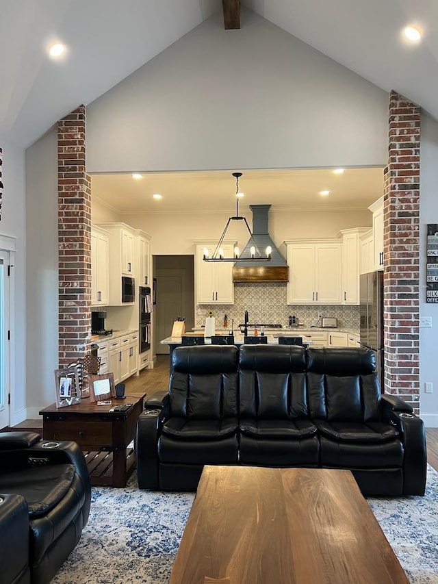 living room with dark wood-style floors, high vaulted ceiling, beam ceiling, and recessed lighting